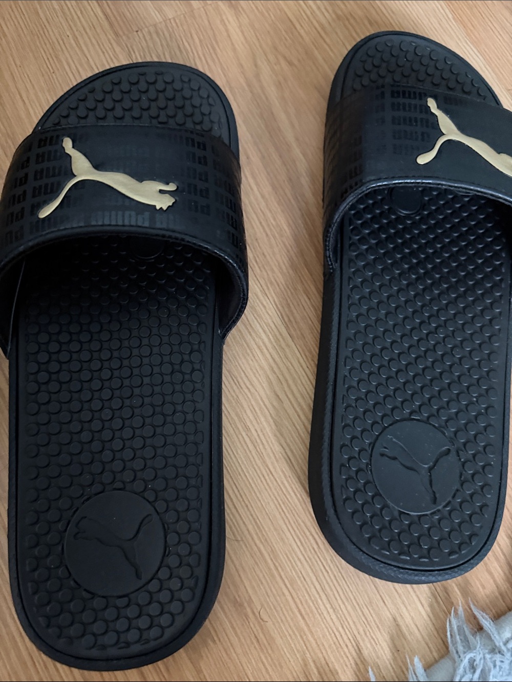 Puma Black Slide Sandals with Gold PUMA Logo